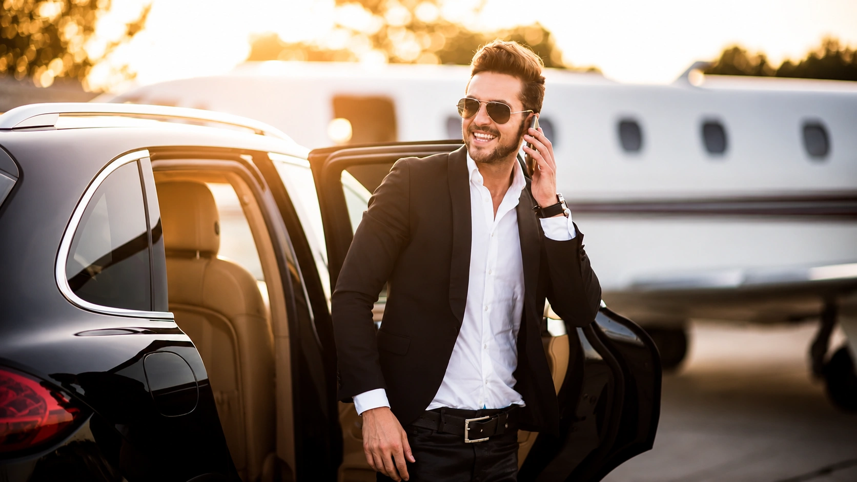 Businessman arriving by chauffeured car