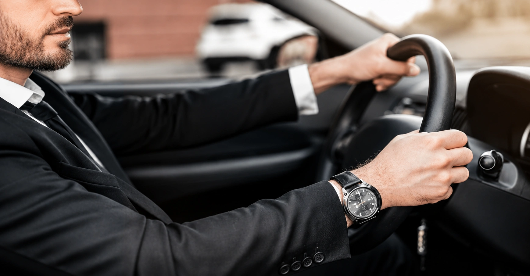 Chauffeur driving an executive sedan