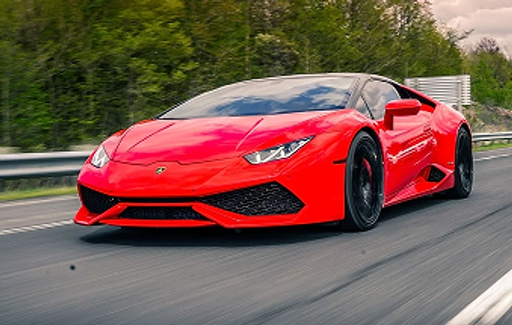 Red Lamborghini Huracán on the road