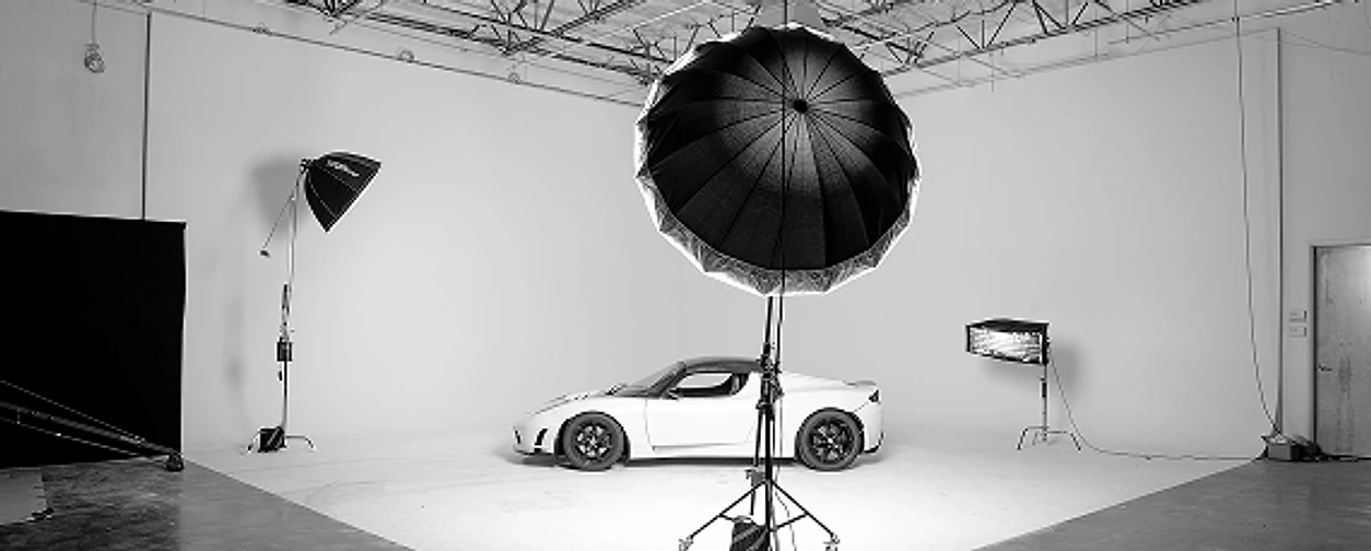 Sports car lit on a film studio sound stage